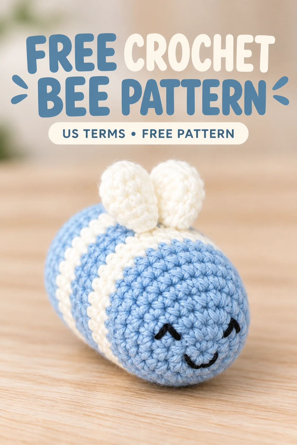 Crochet bee amigurumi pattern with blue and white stripes and two white wings