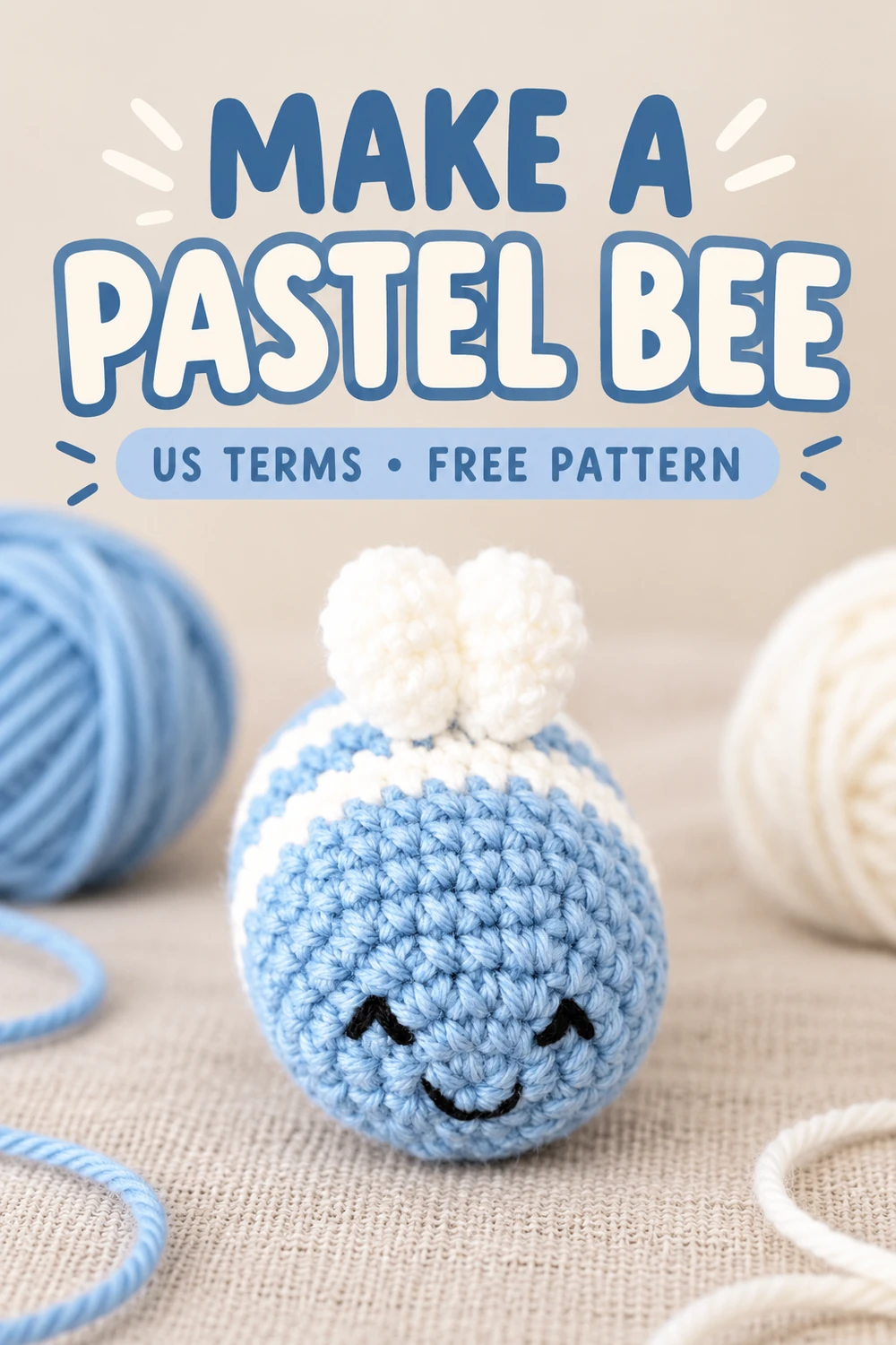 Pastel blue crochet bee beside blue and white yarn