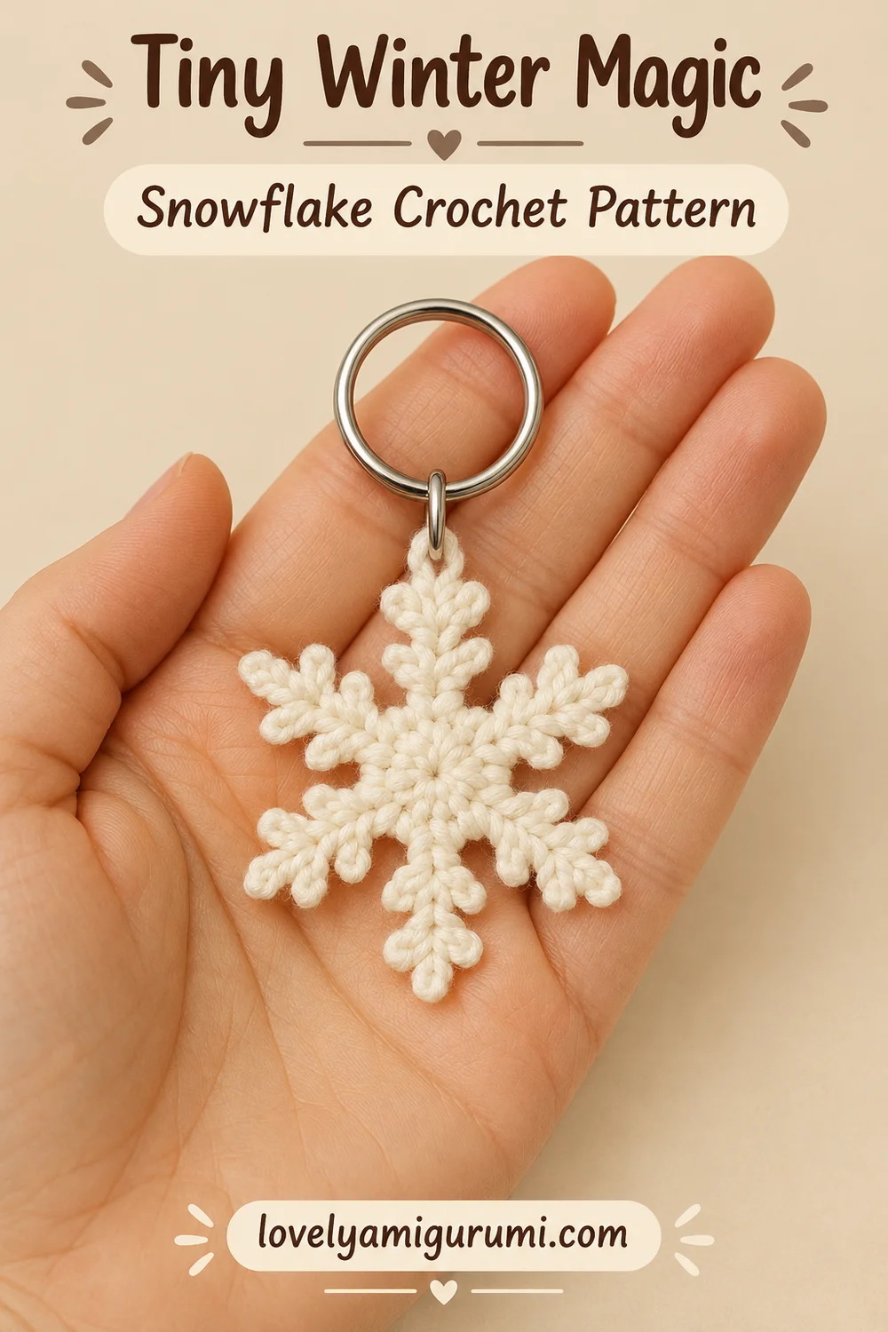 Snowflake Keychain Crochet Pattern shown in a hand